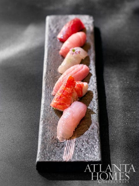 Assortment of sushi on a dark stone platter