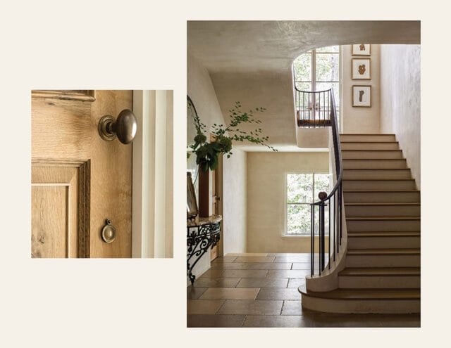 Curved staircase with wood treads and black railing, stone floor, and artwork on wall.