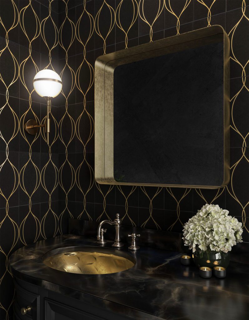 Powder room with black tile and gold art deco pattern, gold mirror, and marble vanity.