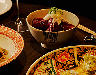 Bowl of food with shredded daikon radish and green onions